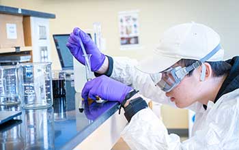 student in a science lab